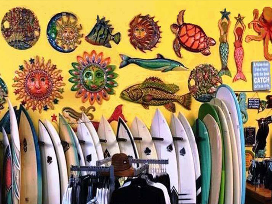 	Wabasso Beach Shop view of surfboards and beach art									